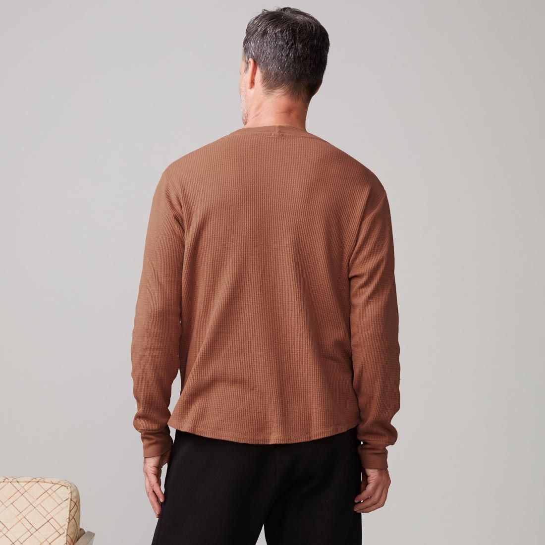 Back view of model wearing the thermal long sleeve crew in caramel.