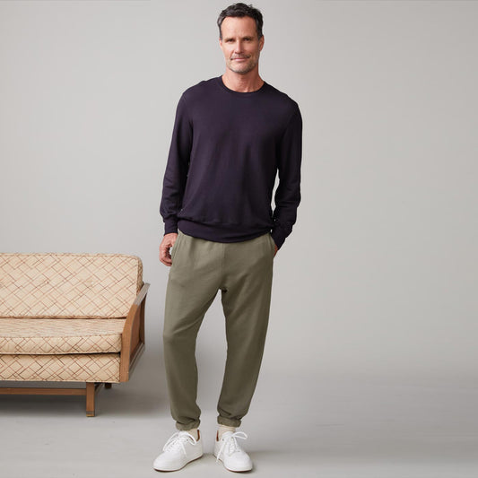 Front view of model wearing the lounge sweatshirt in faded black.