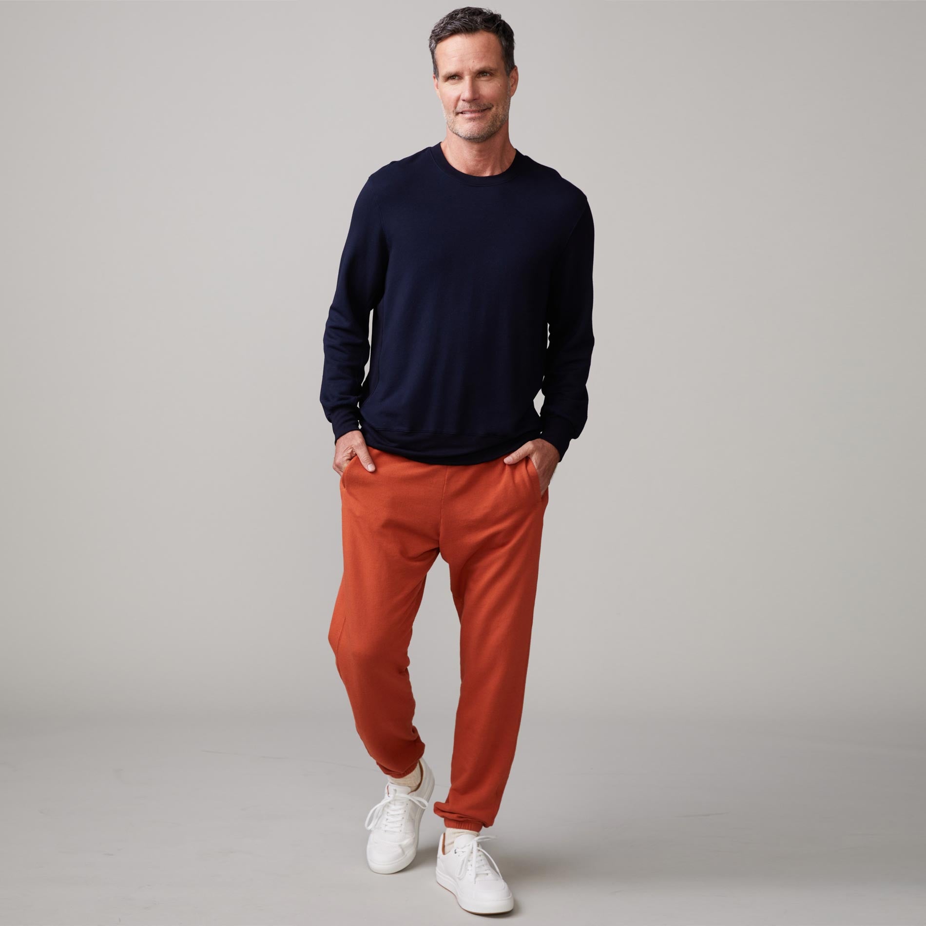 Front view of model wearing the lounge sweatshirt in inca.