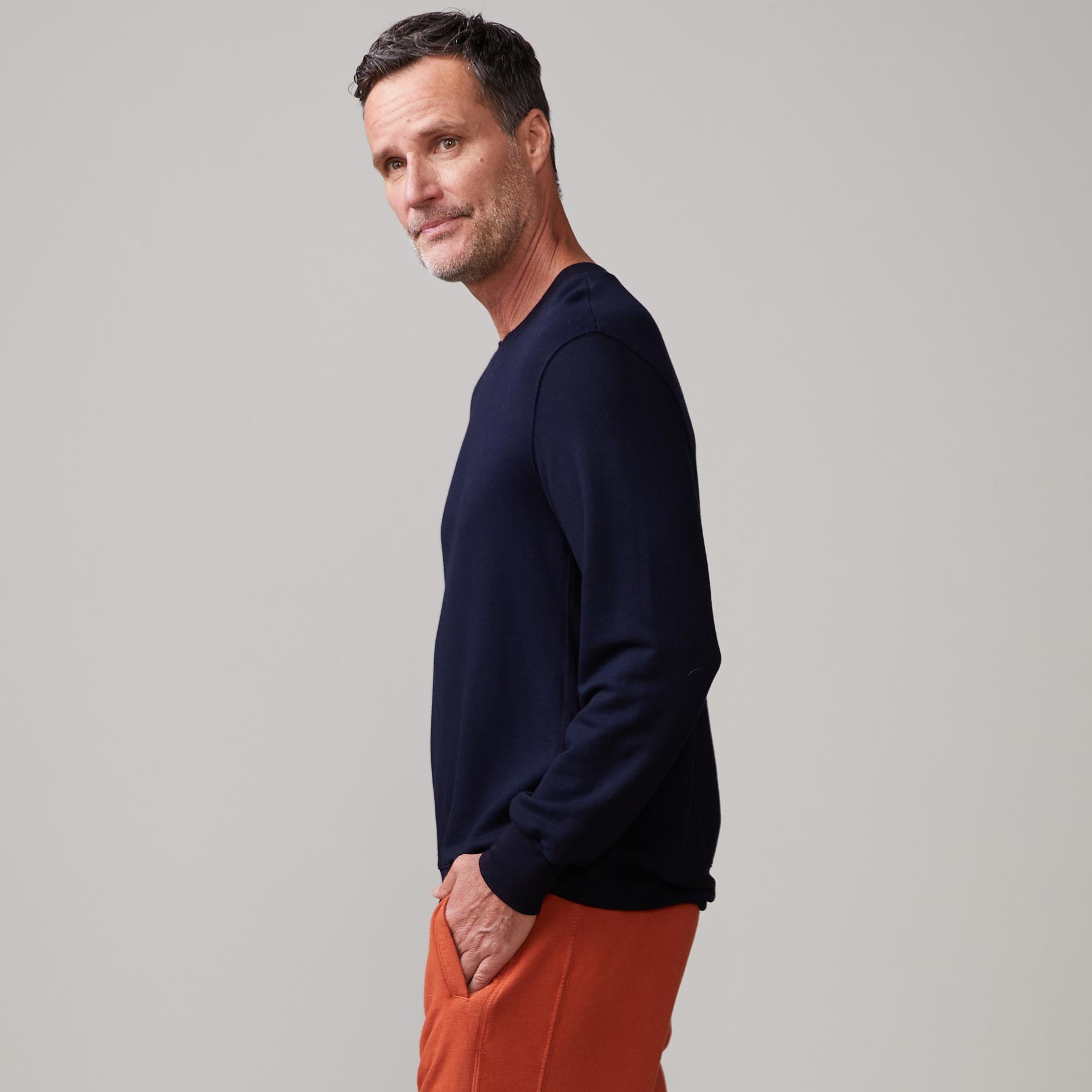 Side view of model wearing the lounge sweatshirt in inca.