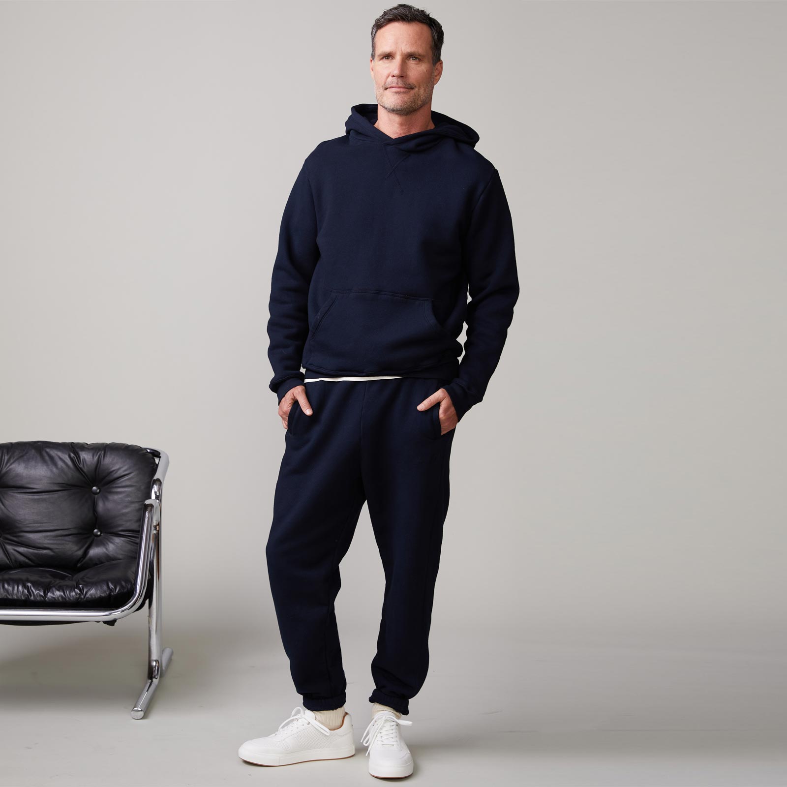 Front view of model wearing the oversized hoody in indigo.