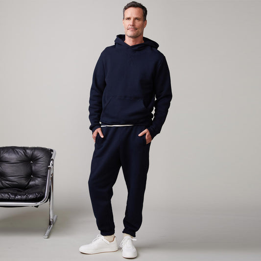 Front view of model wearing the oversized hoody in indigo.