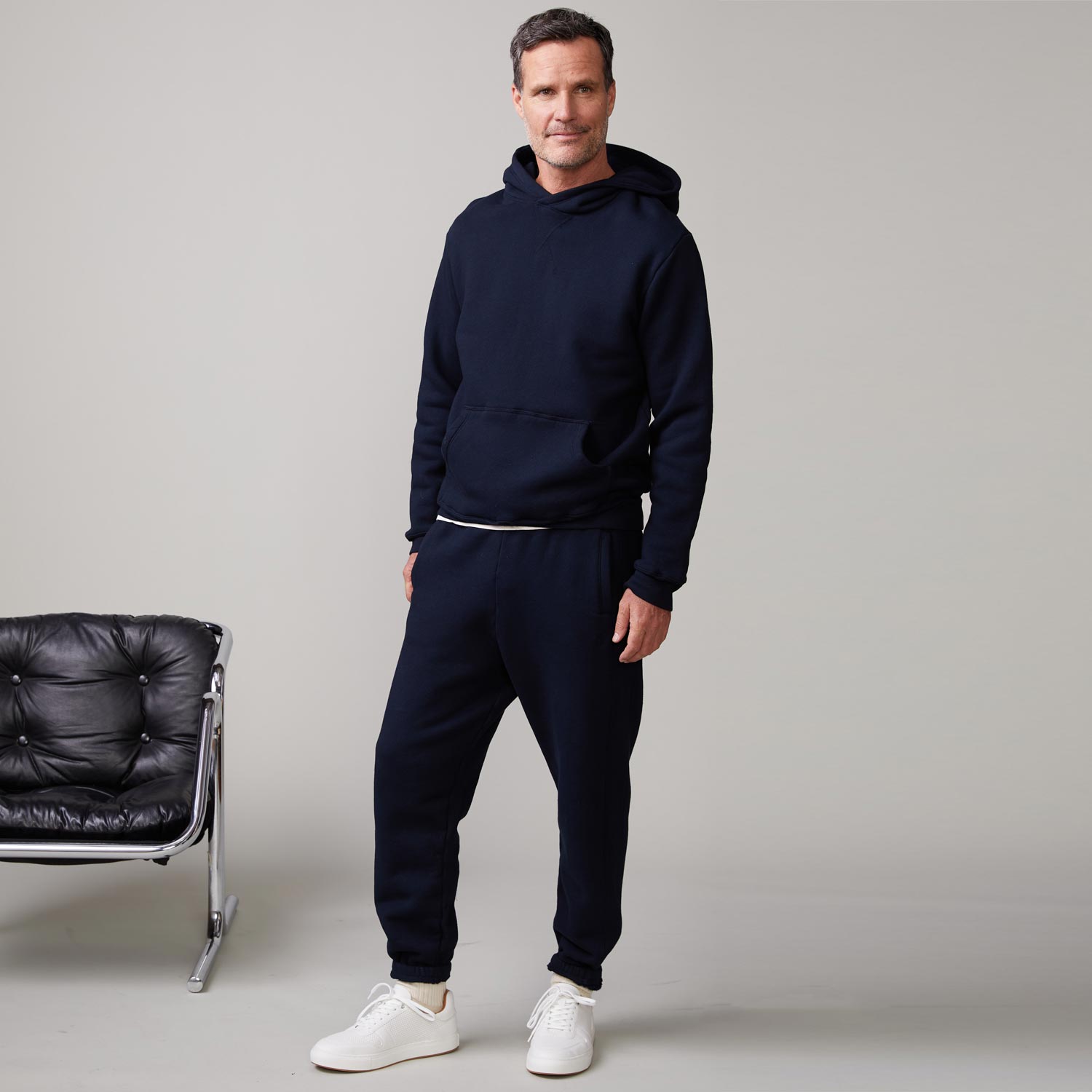 Front view of model wearing the oversized hoody in indigo.