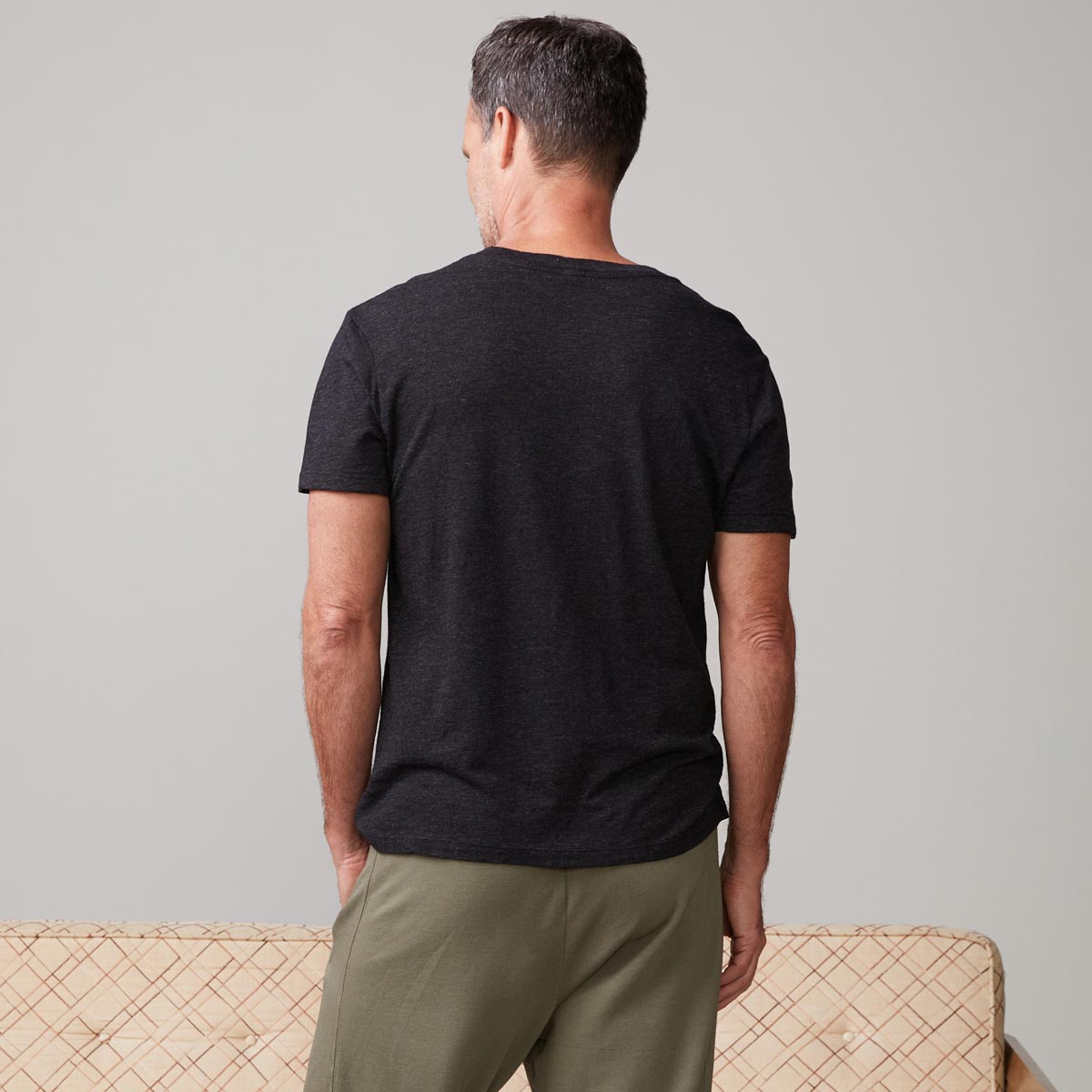 Back view of model wearing the textured tri-blend relaxed crew in black.