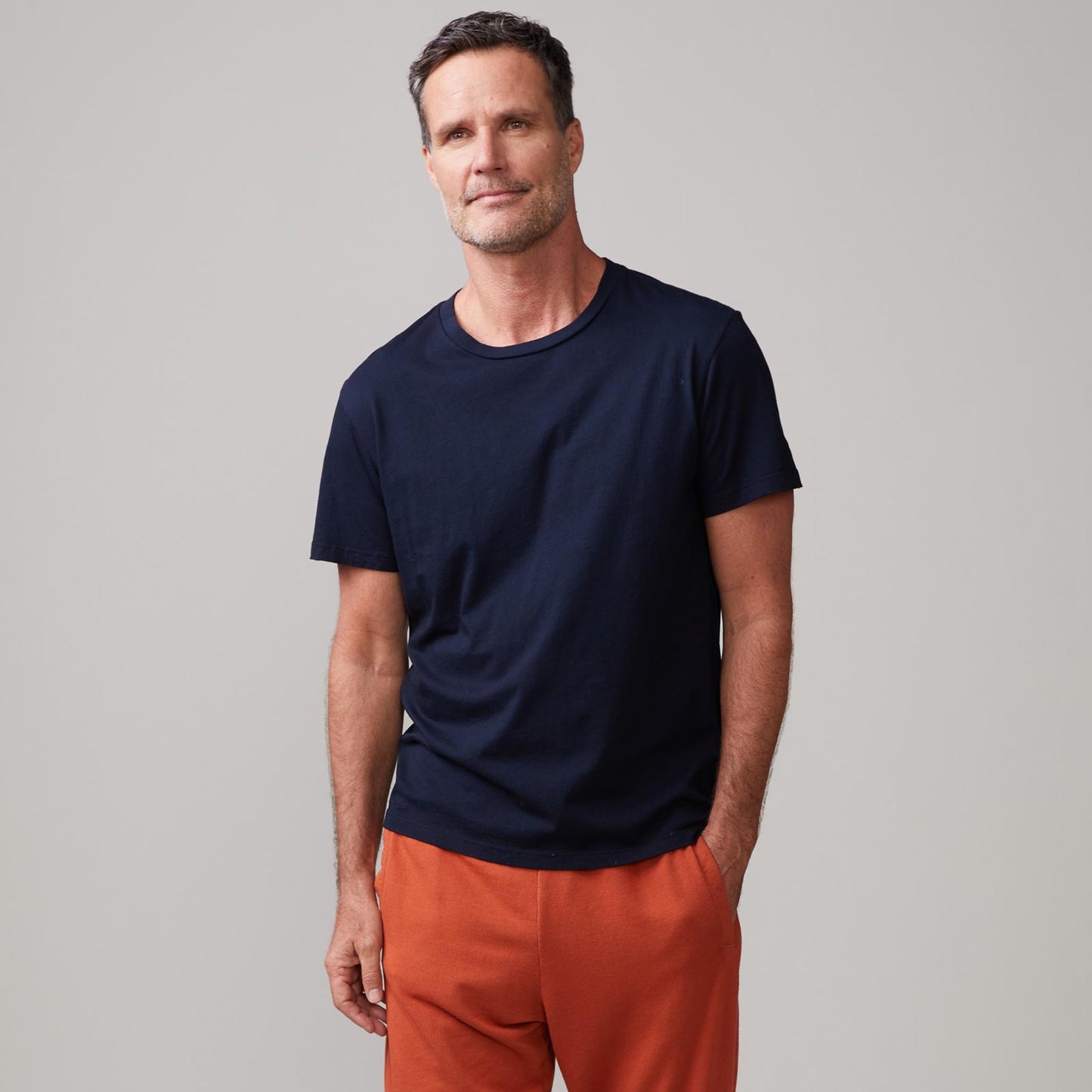 Front view of model wearing the relaxed crew in indigo.