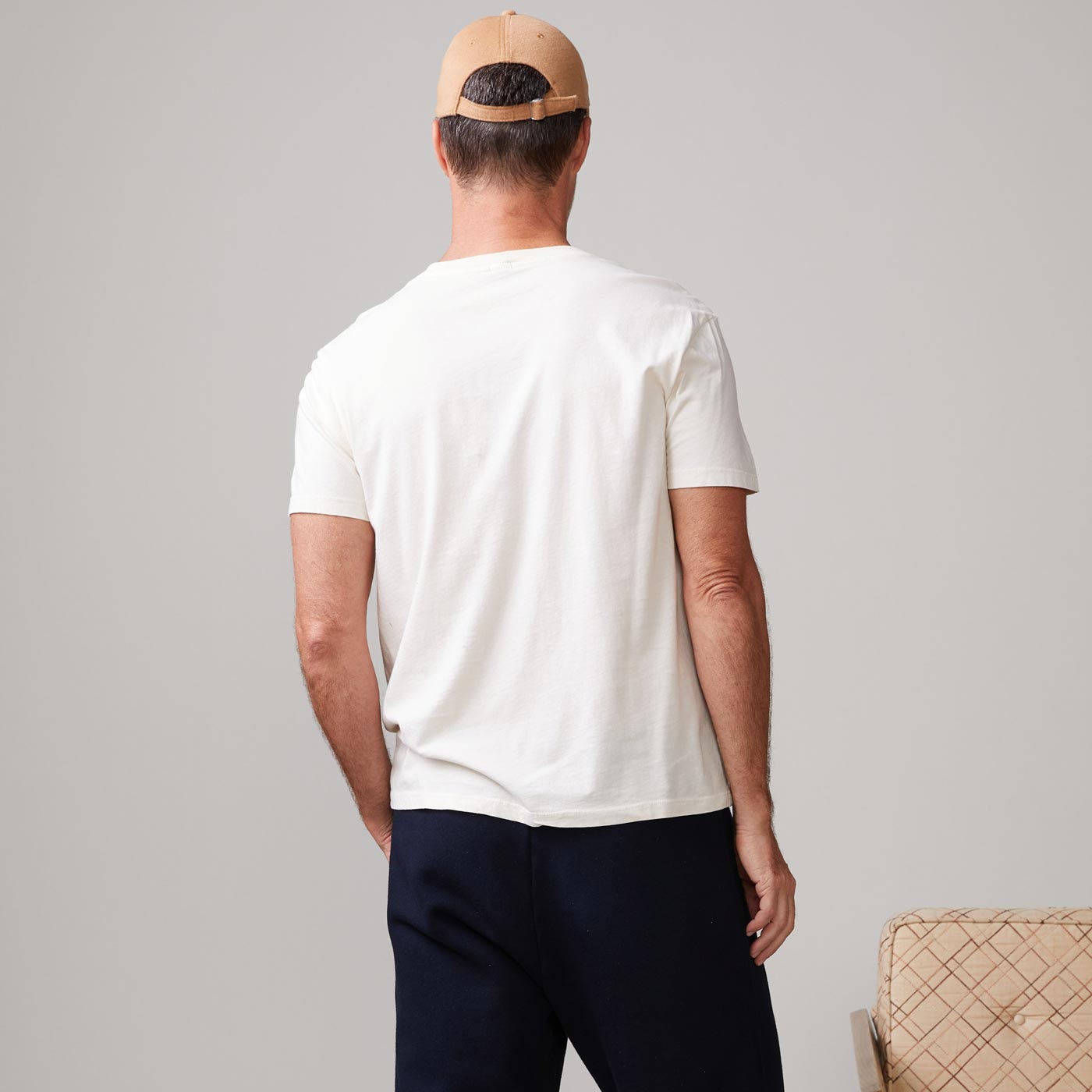 Back view of model wearing the relaxed crew in off white.