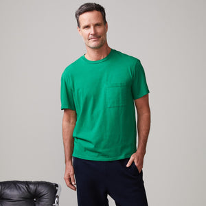 Front view of model wearing the relaxed pocket crew in dusty kelly.
