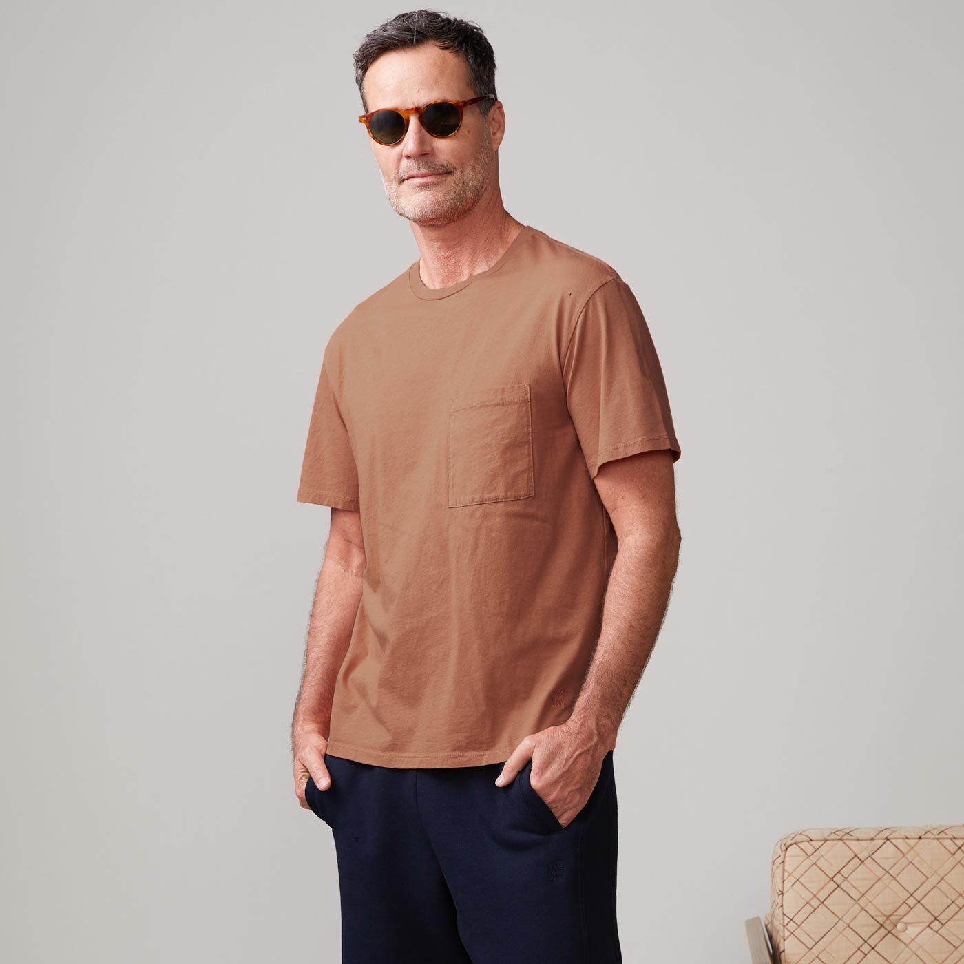 Front view of model wearing the relaxed pocket crew in rust.